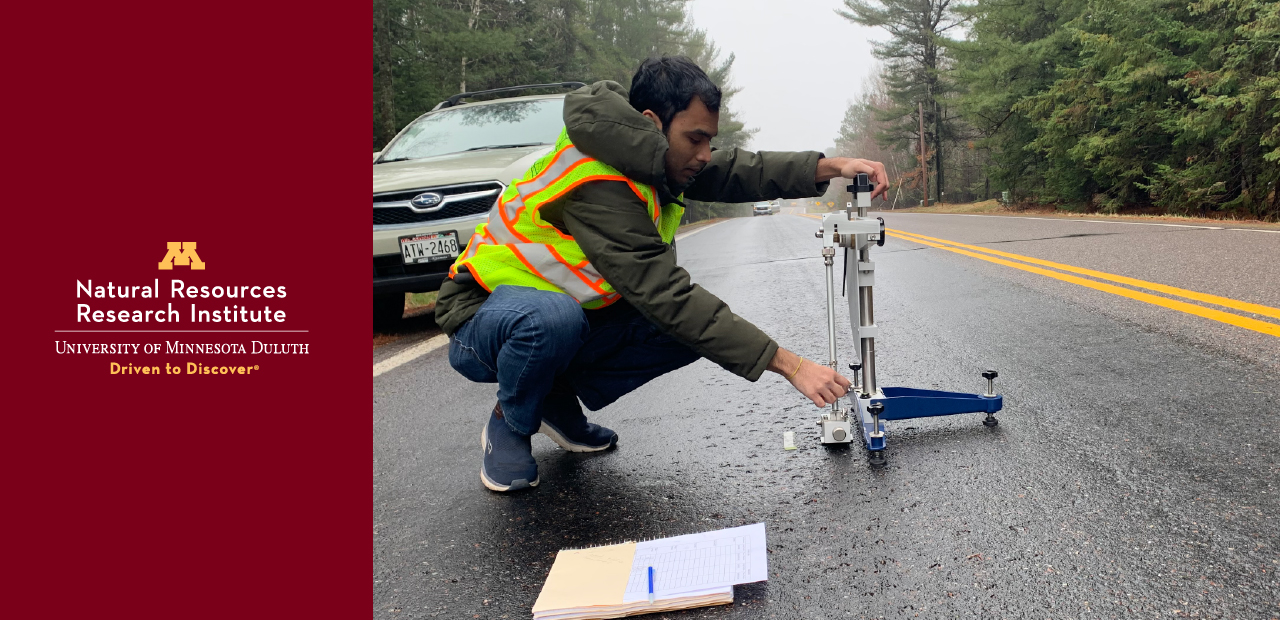 UMD Engineering student Manik Chakraborty uses the British Pendulum friction tester on a stretch of Munger Shaw Road near Duluth.