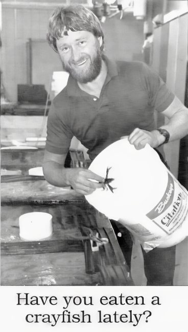 Cover NRRI Now 1989 - Photo of a smiling man holding a crayfish, and headline "Have you eaten a crayfish lately"