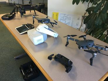 Table top display of five different drone technologies.